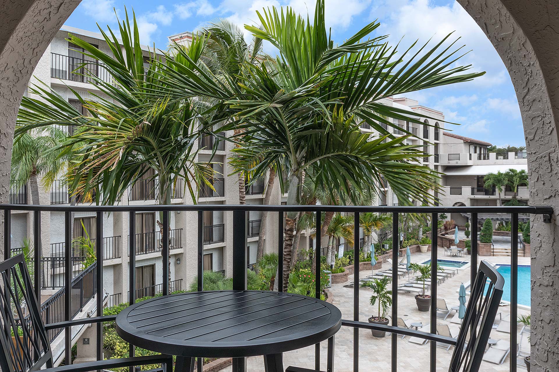 Private balcony with a table and chairs